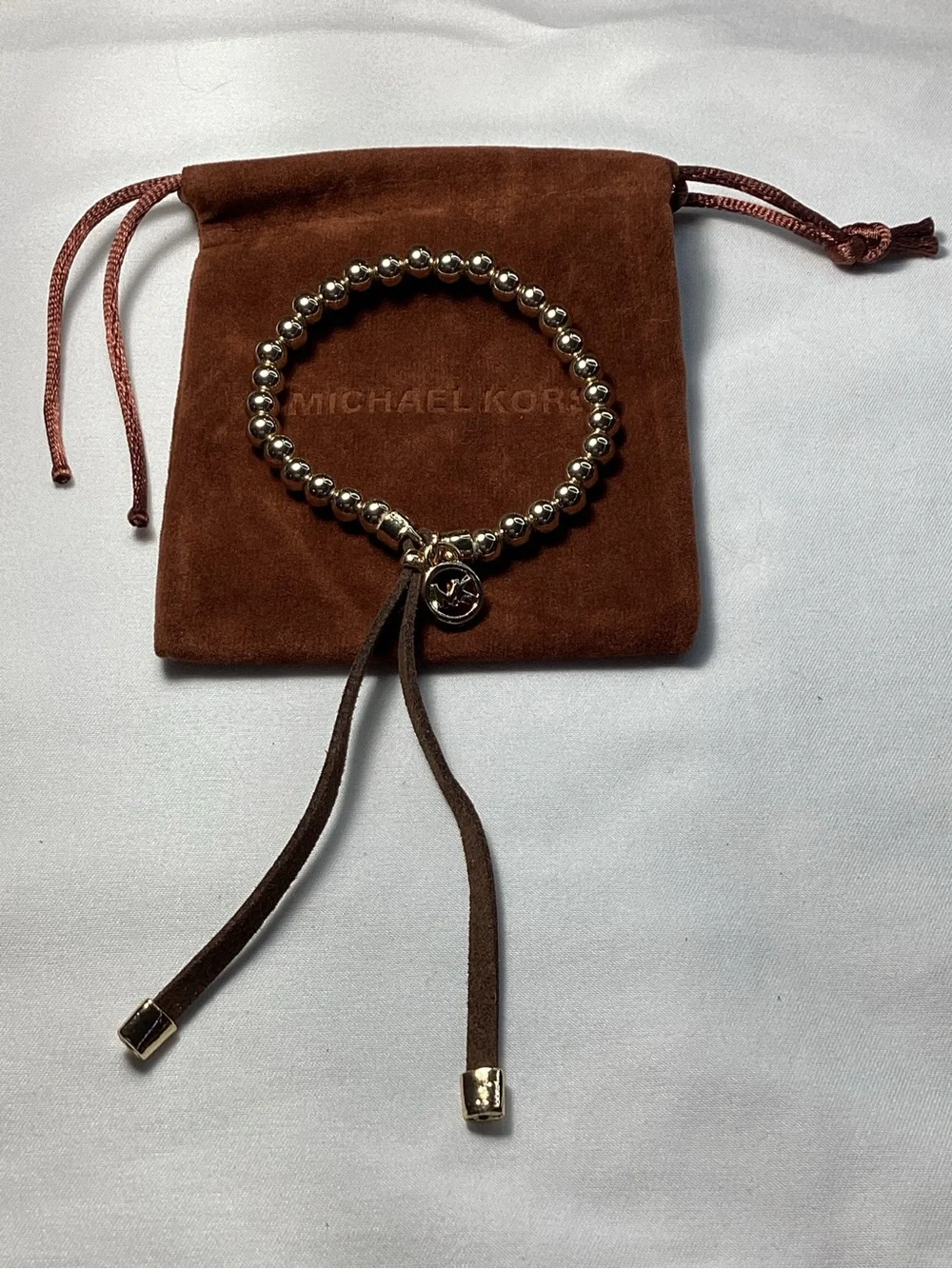 Michael Kors NWT and Dust Bag Gold-Tone Beaded Brown Suede Logo Charm Bracelet